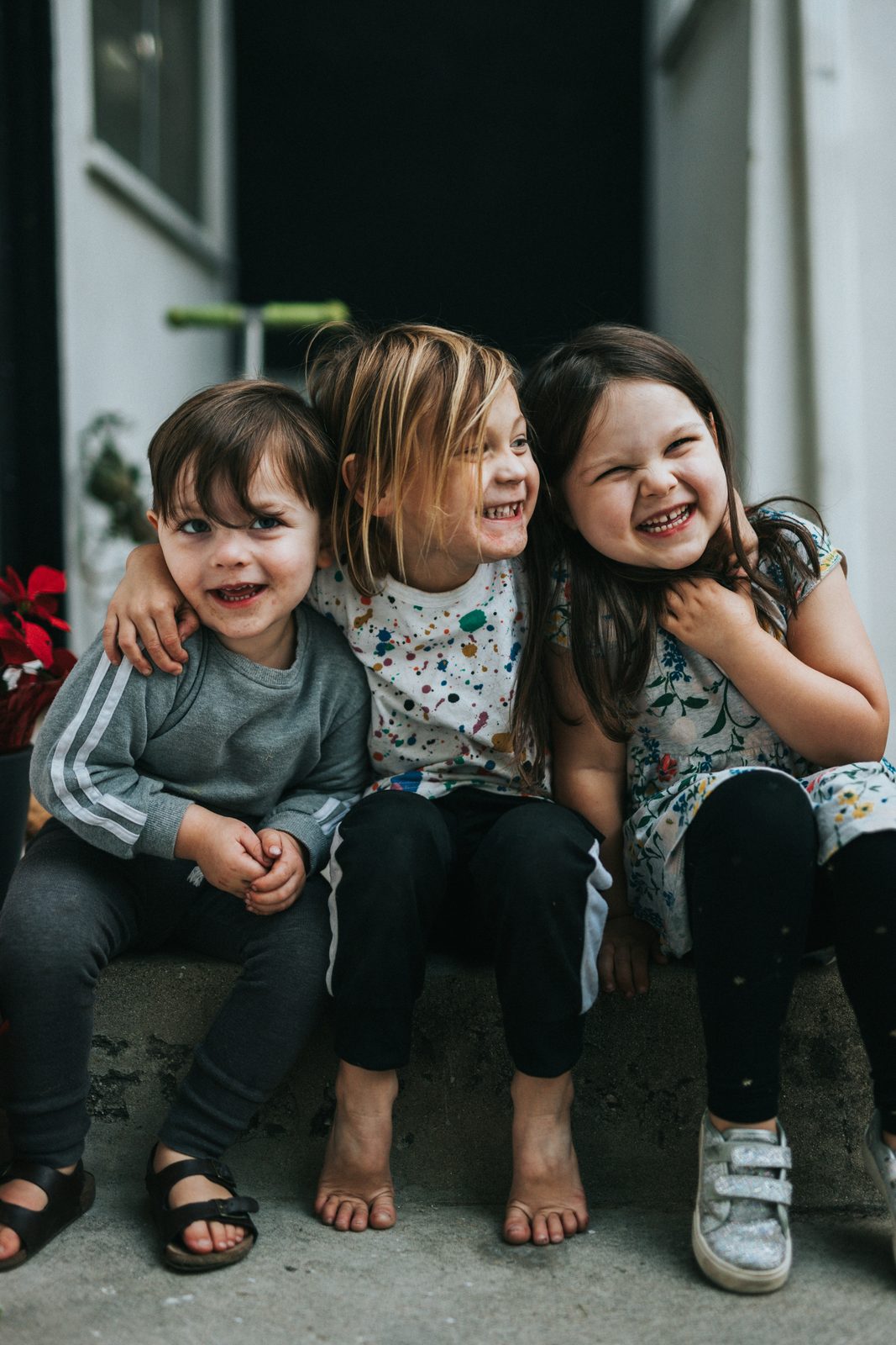 Two children sitting together on the floor